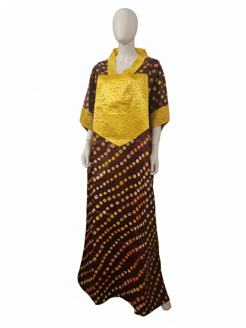 A faceless mannequin wears the Brown & Gold Ankara Kaftan Dress, featuring diagonal yellow and orange dots on a dark base with a bright yellow textured collar—a stylish tribute to African fashion.